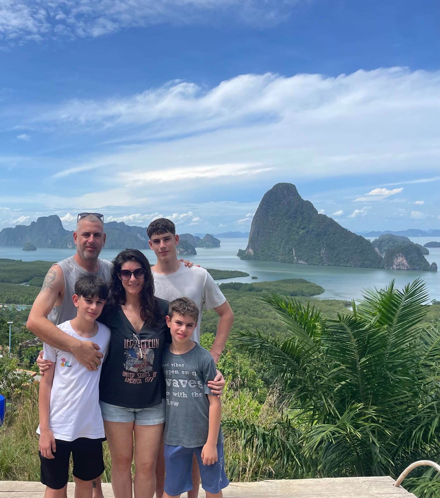 David, Liat and their three boys above the island bay in Thailand
