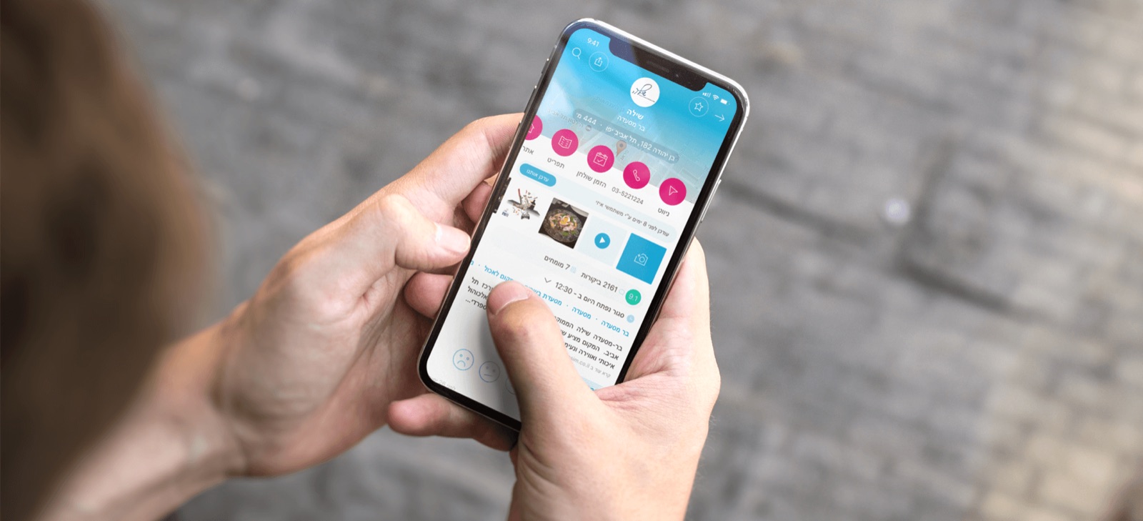 Hand holding a phone showing the Easy search app